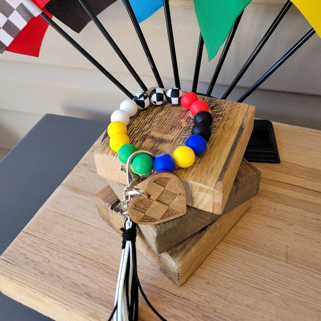 Racing flag silicone bead wristlet key ring.