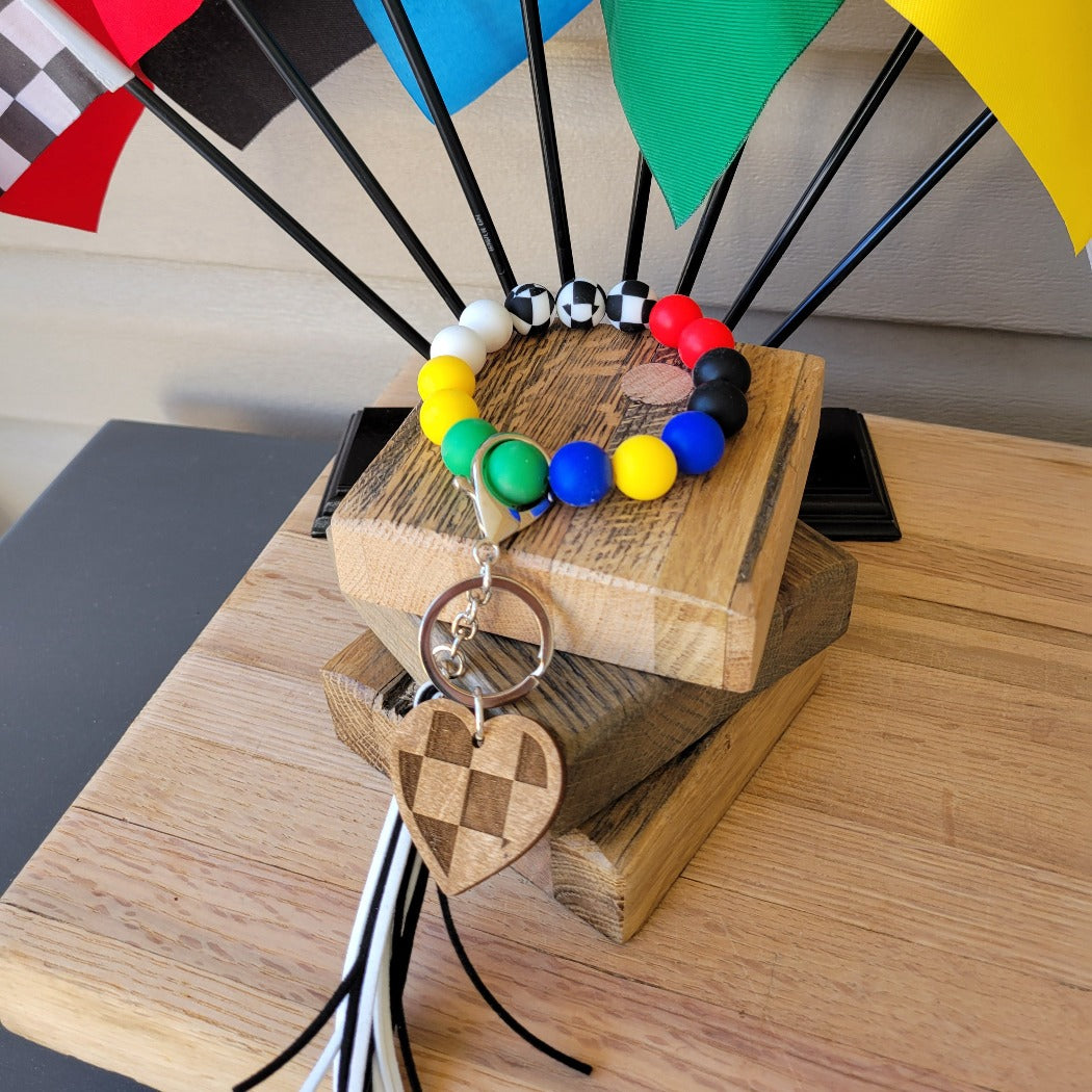 Racing flag silicone bead wristlet key ring.