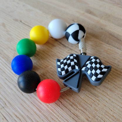 Silicone bead tumbler charm.
