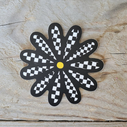 Checkered daisy sticker.
